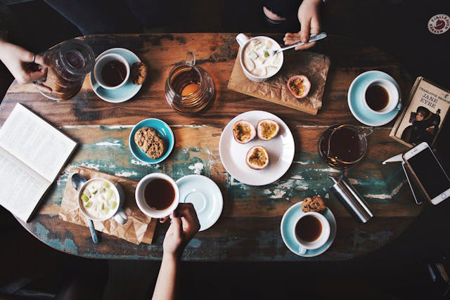 Cups of Coffee and Breakfast Items on a Table