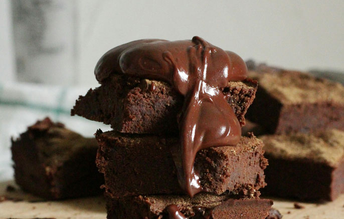 brownies baked with dark chocolate and topped with chocolate sauce