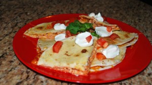 chicken quesadillas with tomatoes, sour cream, cilantro, salsa, party food, appetizer, how to make quesadillas, easy chicken recipe