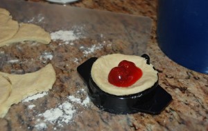 cherry filling in empanadas with pie crimper, mexican recipes, cinco de mayo, hand pies, dessert recipes, dish dish, dishdish