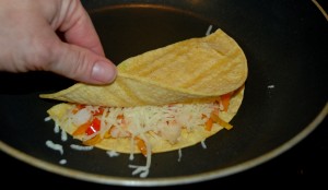 shrimp quesadilla in skillet with peppers and cheese, cinco de mayo, mexican recipes