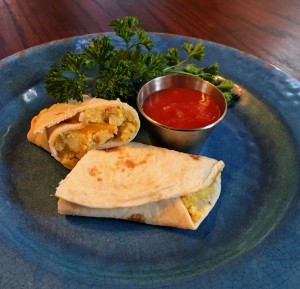 breakfast burrito on plate with salsa and parsley, breakfast recipe, healthy breakfast