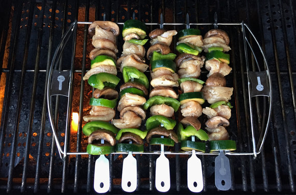 cave tools kabob set on gas grill, chicken kebabs
