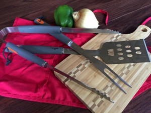 BBQ Tools with cutting board, apron and vegetables