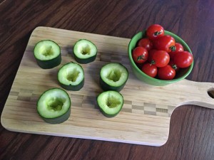 hulled cucumbers and tomatoes on cutting board, appetizer recipe