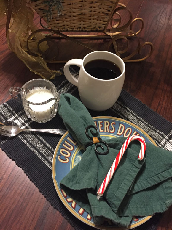 Lanna coffee in mug with plate, milk, and spoon