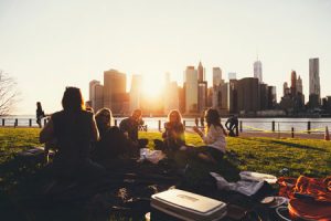 Friends Sitting on Grass in Park - Unsplash Ben Duchac