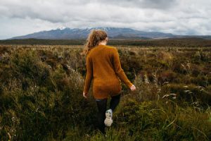 woman walking in grass