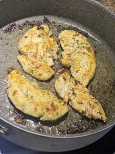 Chicken Alfredo Recipe - chicken pieces in skillet